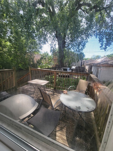 6016 South Carpenter Street Chicago, IL 60621 - Photo 7 of 15 a backyard of a house with table and chairs