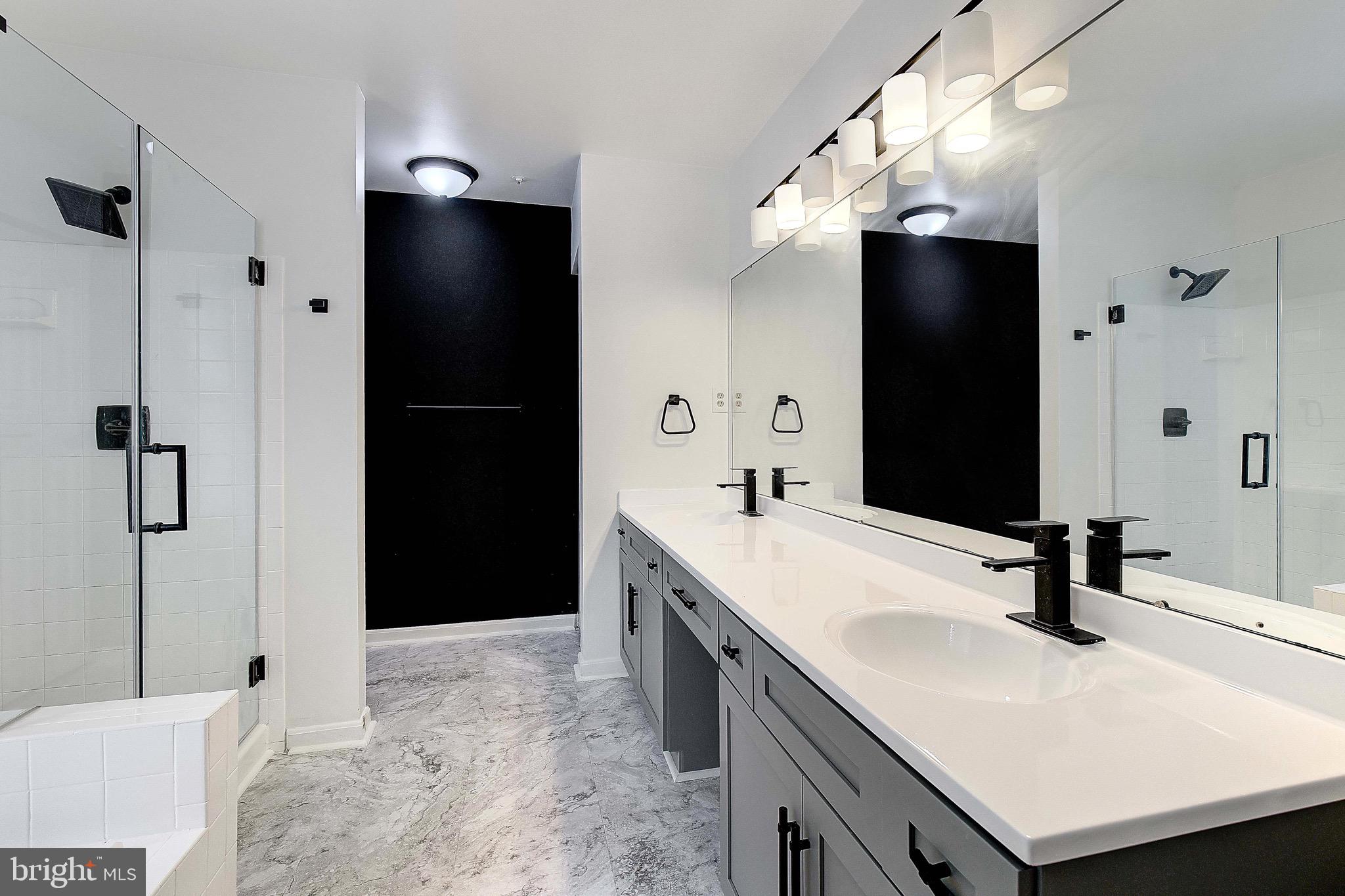 721 Small Reward Road Huntingtown, MD 20639 - Photo 20 of 51 a bathroom with a sink and a mirror