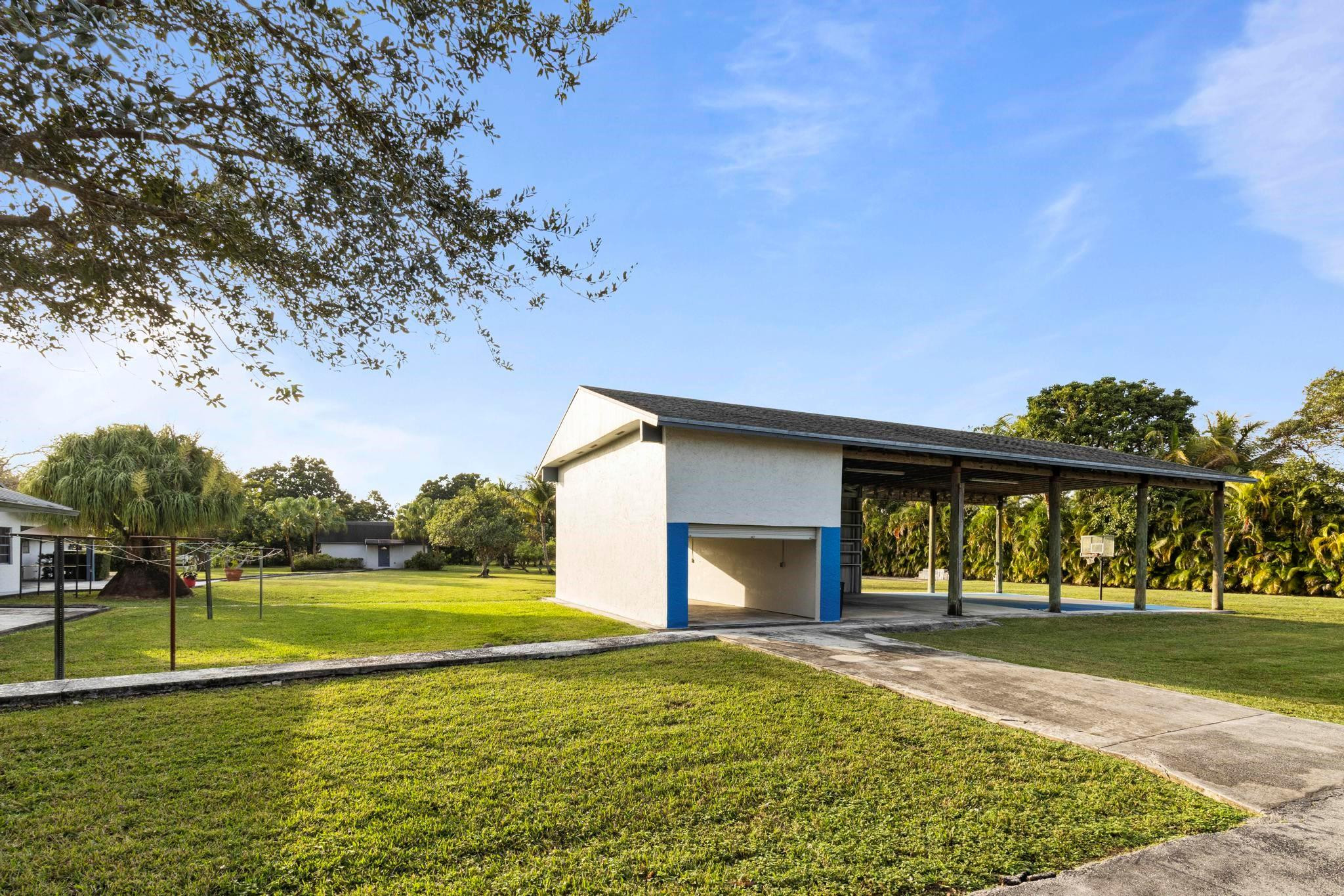 17781 Southwest 52nd Court Southwest Ranches, FL 33331 - Photo 12 of 39 a view of a house with a yard