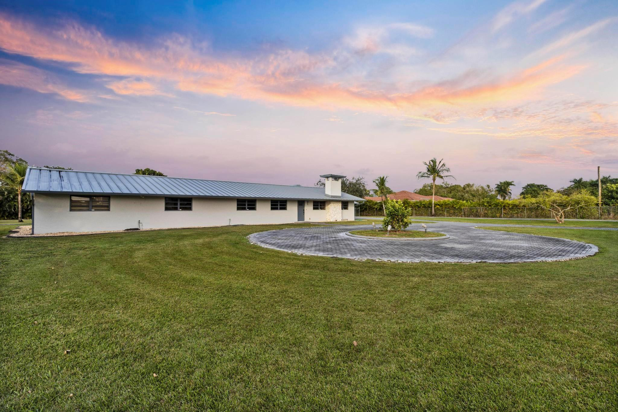 17781 Southwest 52nd Court Southwest Ranches, FL 33331 - Photo 18 of 39 a view of a big house with a big yard