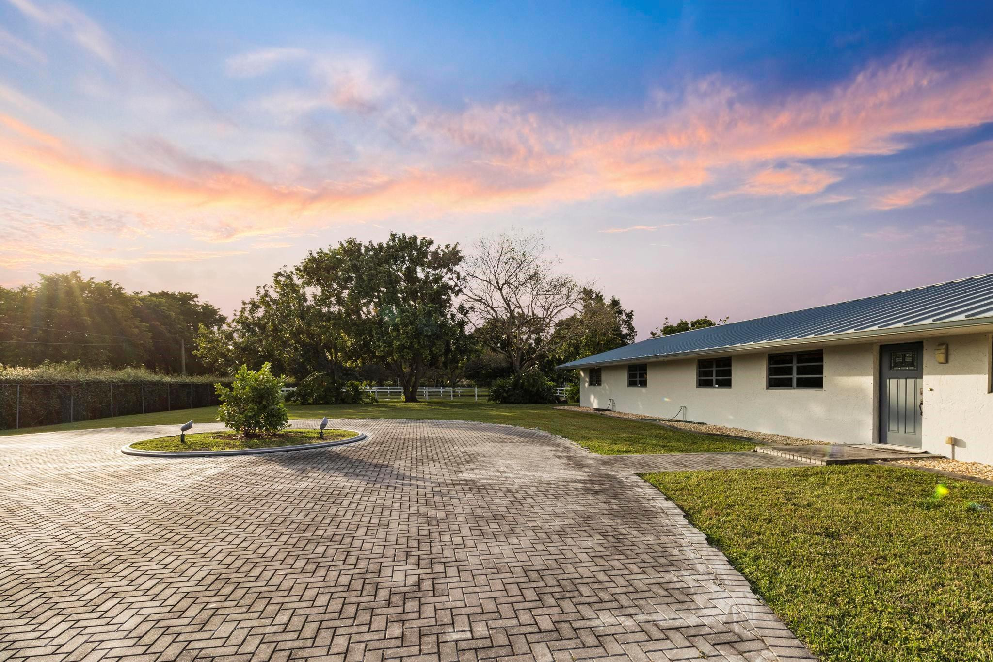 17781 Southwest 52nd Court Southwest Ranches, FL 33331 - Photo 19 of 39 a view of a house with a yard