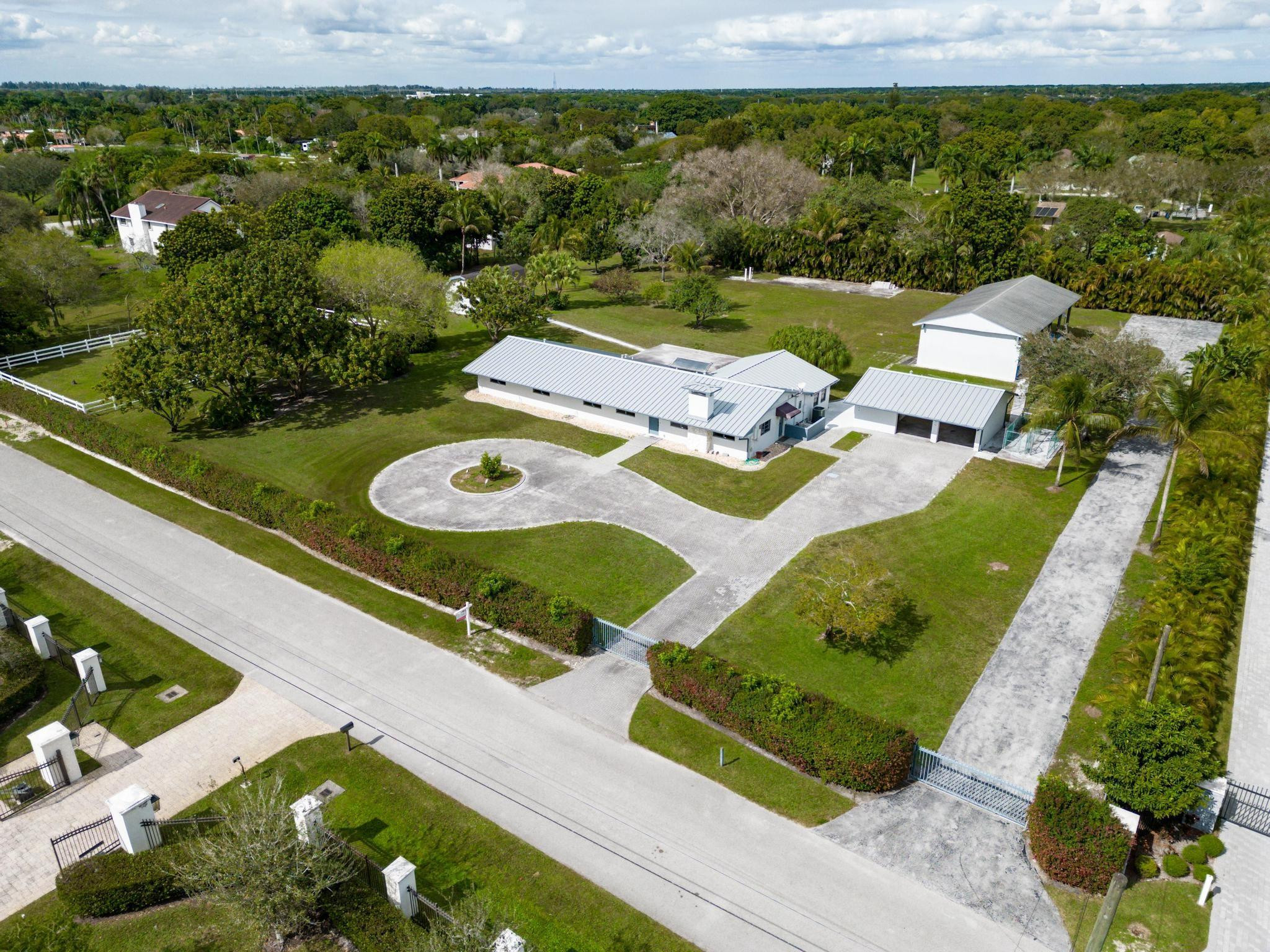 17781 Southwest 52nd Court Southwest Ranches, FL 33331 - Photo 26 of 39 a view of a pool patio and yard