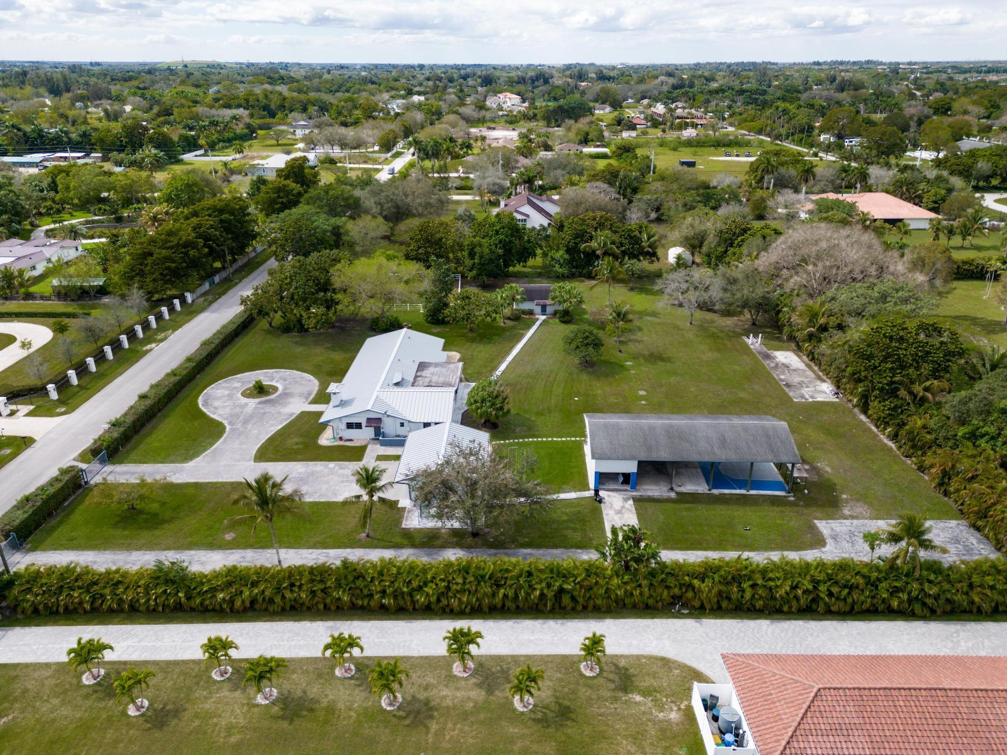 17781 Southwest 52nd Court Southwest Ranches, FL 33331 - Photo 31 of 39 an aerial view of house with yard swimming pool and outdoor seating