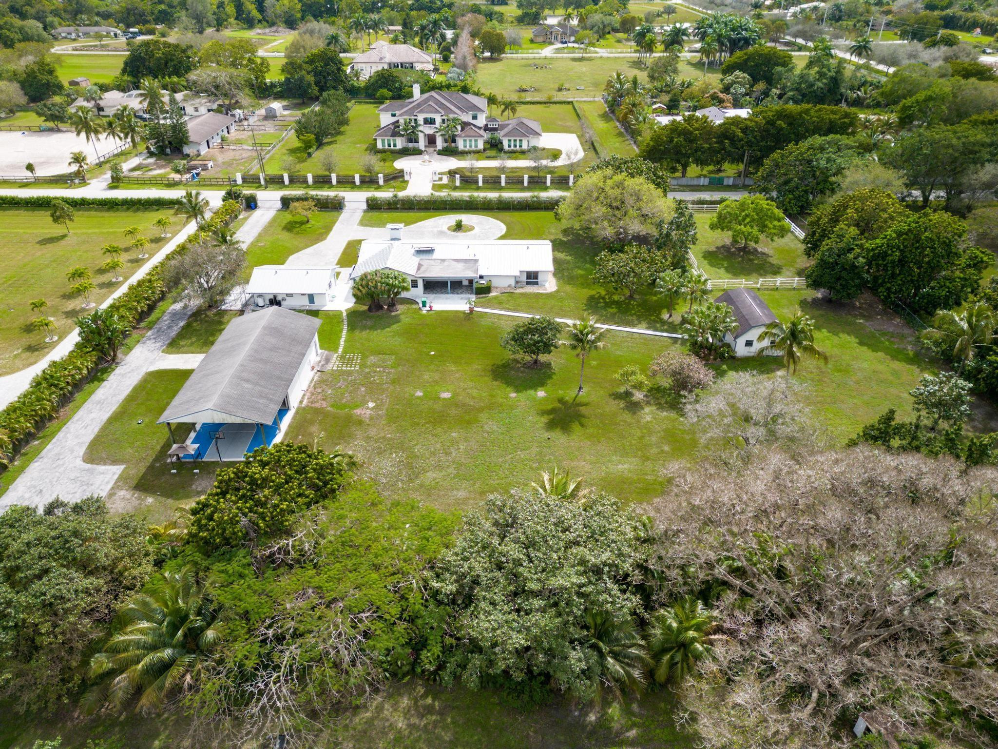 17781 Southwest 52nd Court Southwest Ranches, FL 33331 - Photo 32 of 39 a view of residential houses with yard