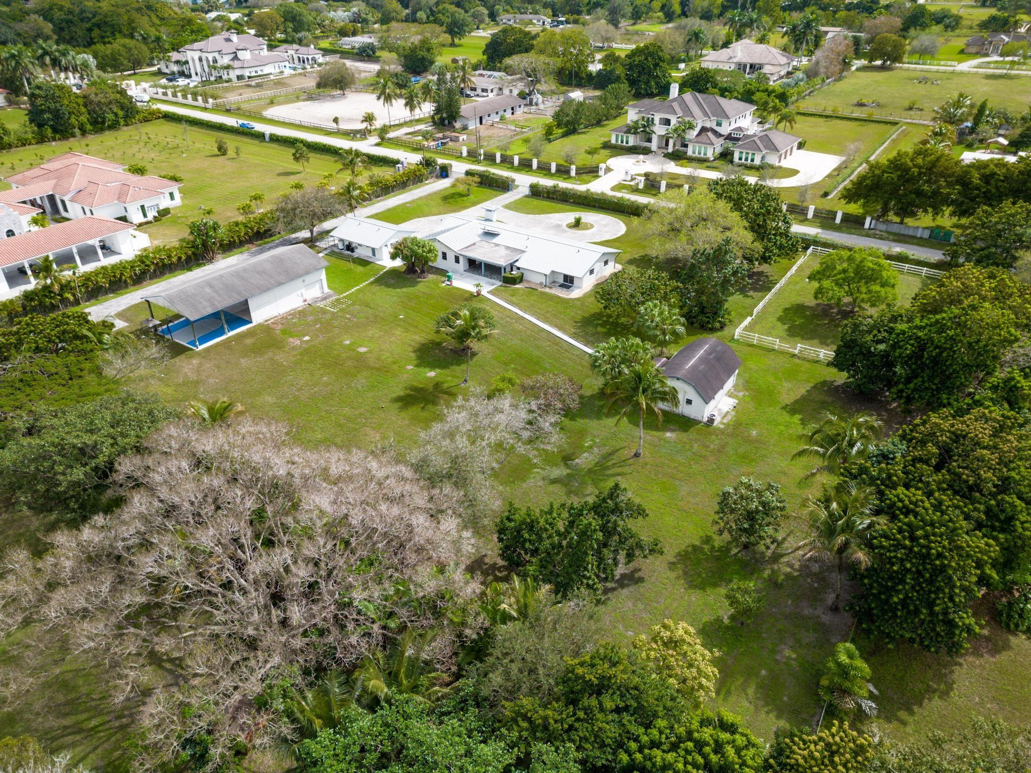 17781 Southwest 52nd Court Southwest Ranches, FL 33331 - Photo 33 of 39 an aerial view of residential house with outdoor space and swimming pool