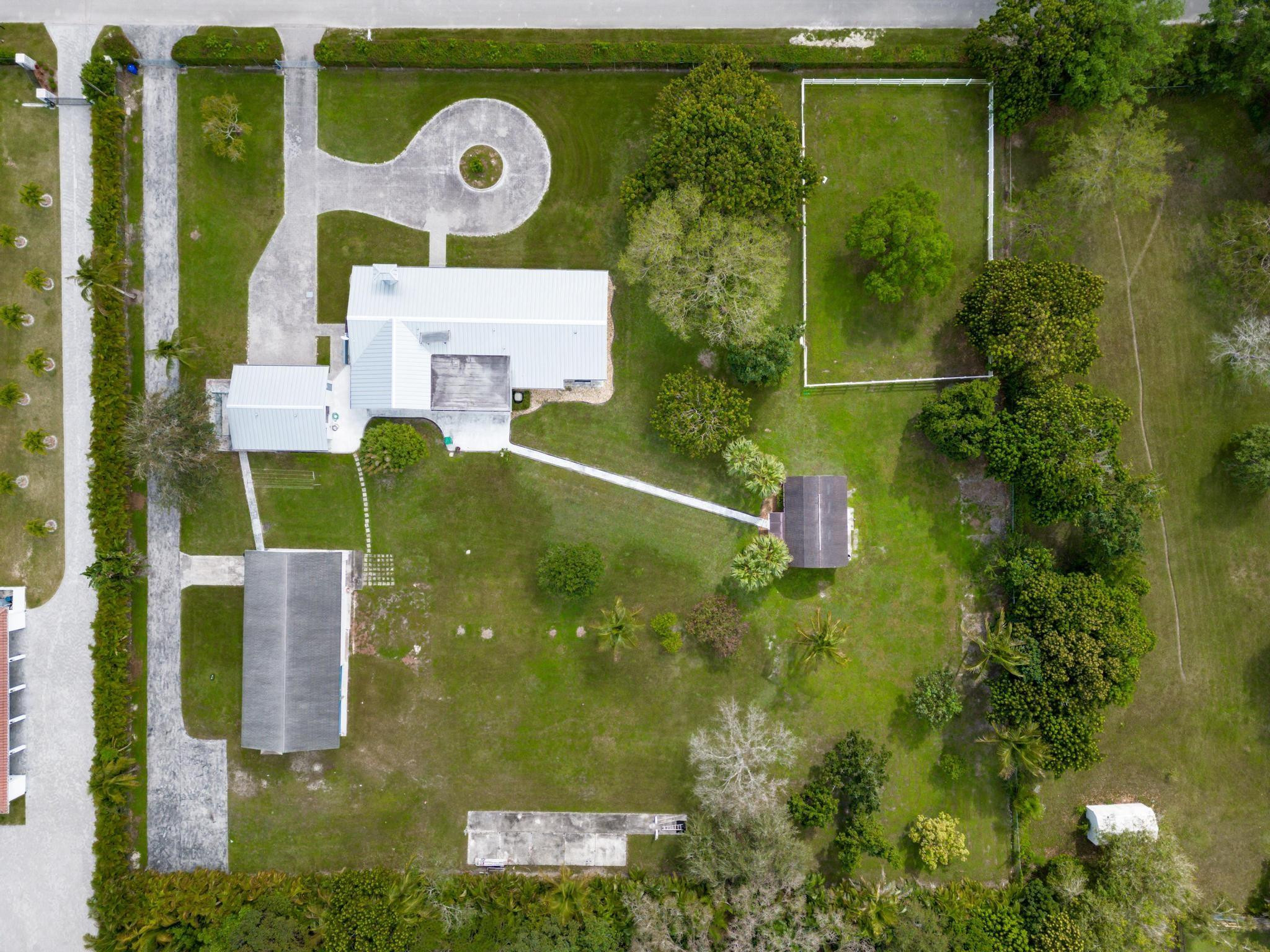 17781 Southwest 52nd Court Southwest Ranches, FL 33331 - Photo 37 of 39 an aerial view of residential house with outdoor space and trees all around