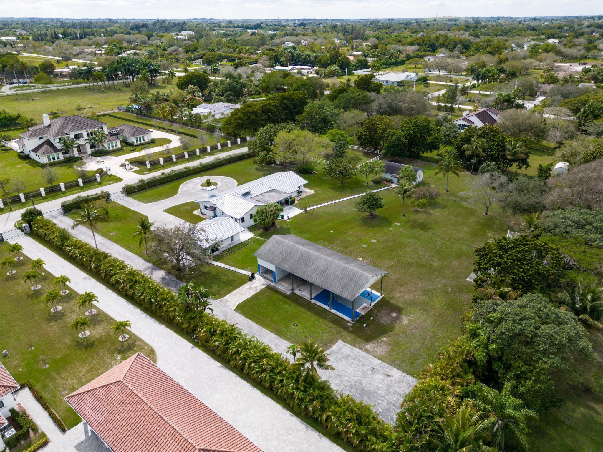 17781 Southwest 52nd Court Southwest Ranches, FL 33331 - Photo 38 of 39 an aerial view of a house with a lake view