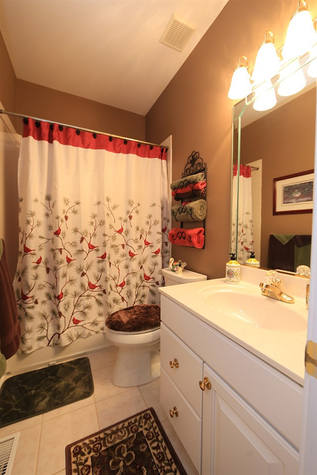 521 Competition Road Raleigh, NC 27603 - Photo 14 of 25 This full bath is located in hall next to second bedroom on main level. Second Full Bath on Main Floor