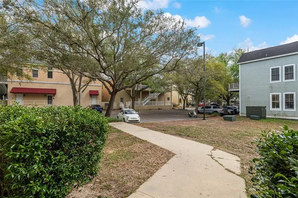 a view of a street with houses on both side