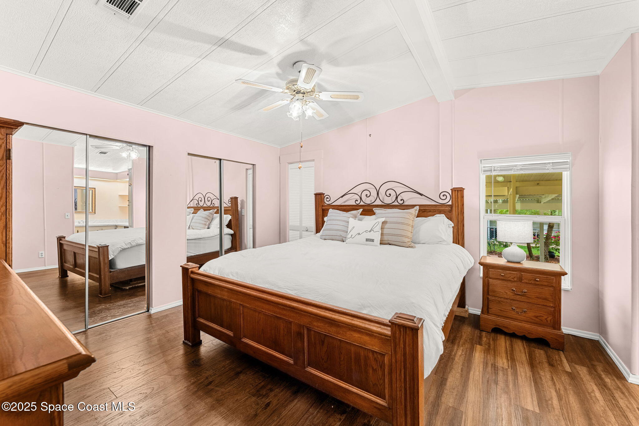 1885 Mango Street Northeast Palm Bay, FL 32905 - Photo 11 of 36 a bed room with a bed and a chandelier