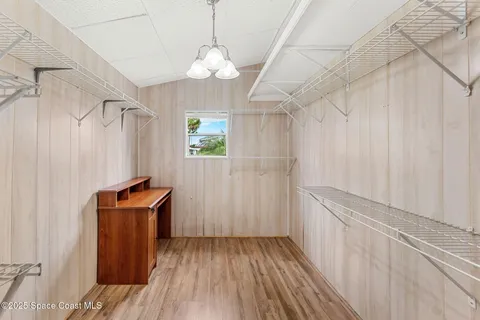 a view of a room with wooden floor and staircase