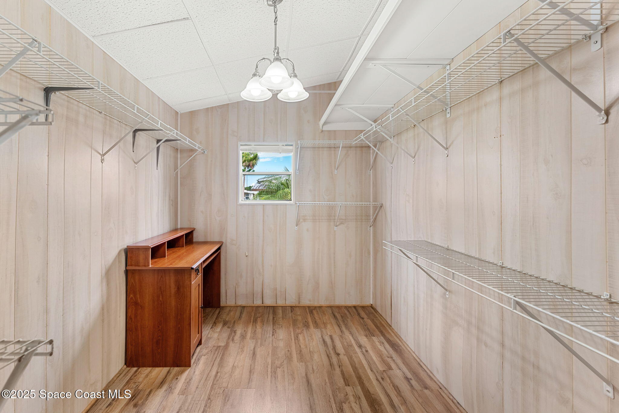 1885 Mango Street Northeast Palm Bay, FL 32905 - Photo 12 of 36 a view of a room with wooden floor and staircase