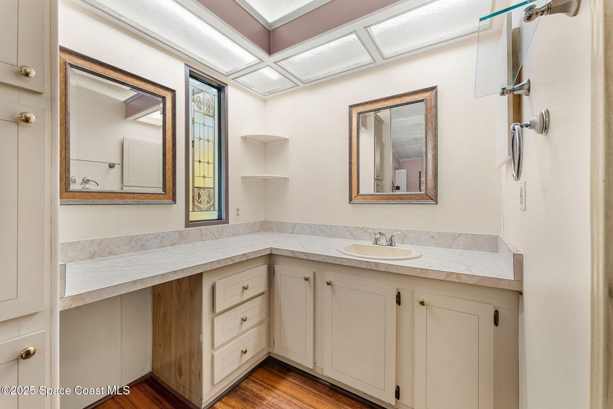 1885 Mango Street Northeast Palm Bay, FL 32905 - Photo 13 of 36 a bathroom with a granite countertop sink mirror and