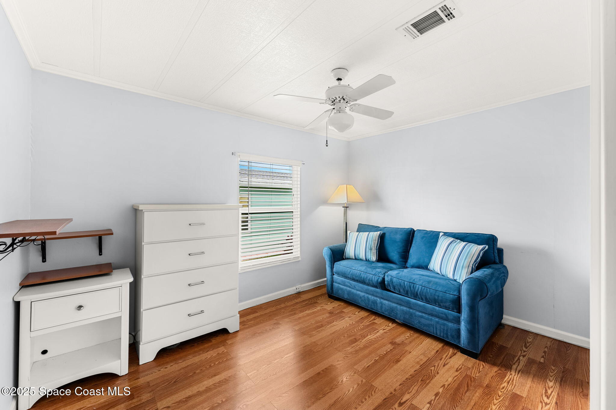 1885 Mango Street Northeast Palm Bay, FL 32905 - Photo 15 of 36 a living room with furniture and a dresser