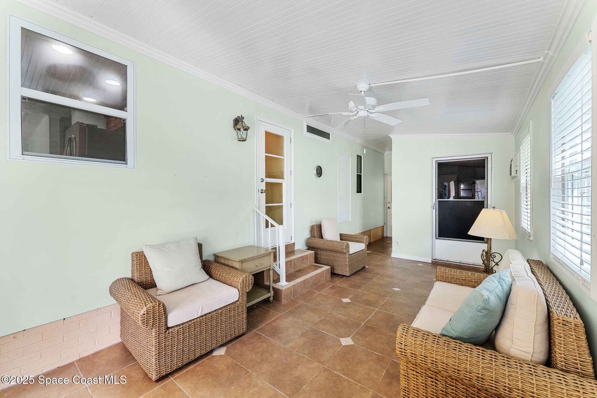 1885 Mango Street Northeast Palm Bay, FL 32905 - Photo 17 of 36 a living room with furniture and a flat screen tv