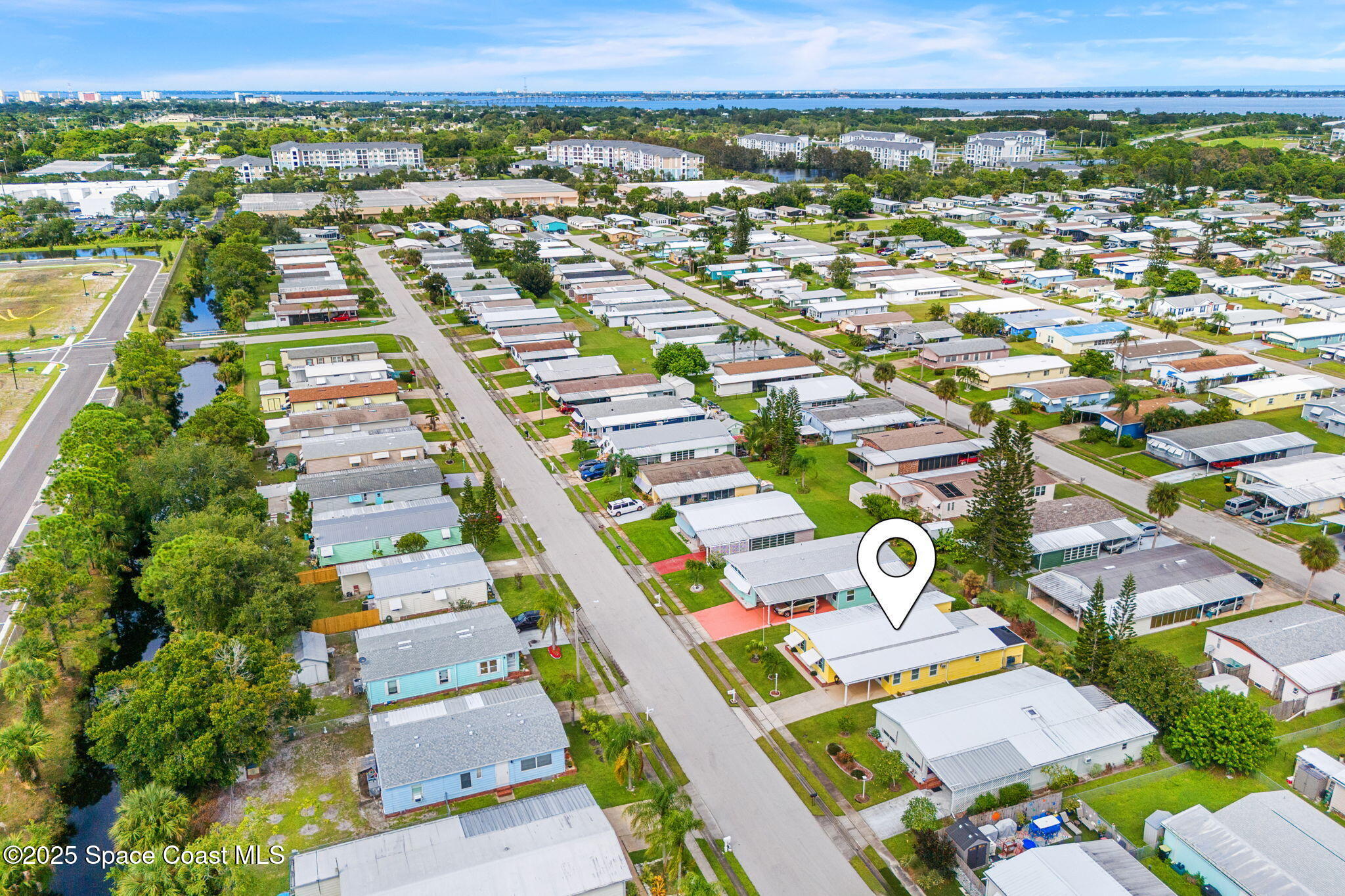 1885 Mango Street Northeast Palm Bay, FL 32905 - Photo 2 of 36 an aerial view of residential houses with outdoor space
