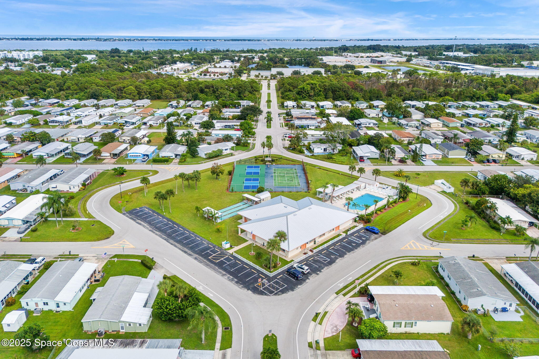 1885 Mango Street Northeast Palm Bay, FL 32905 - Photo 29 of 36 an aerial view of residential houses with outdoor space and swimming pool
