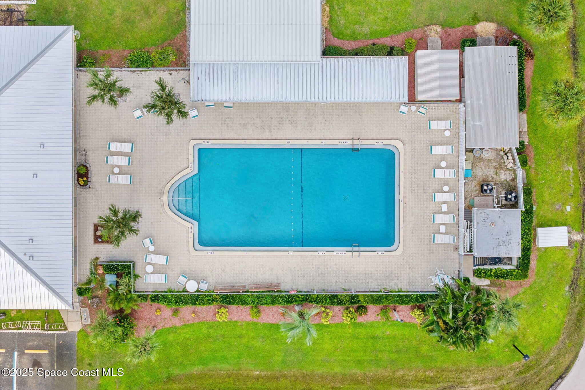 1885 Mango Street Northeast Palm Bay, FL 32905 - Photo 30 of 36 an aerial view of a house with a yard and lake view