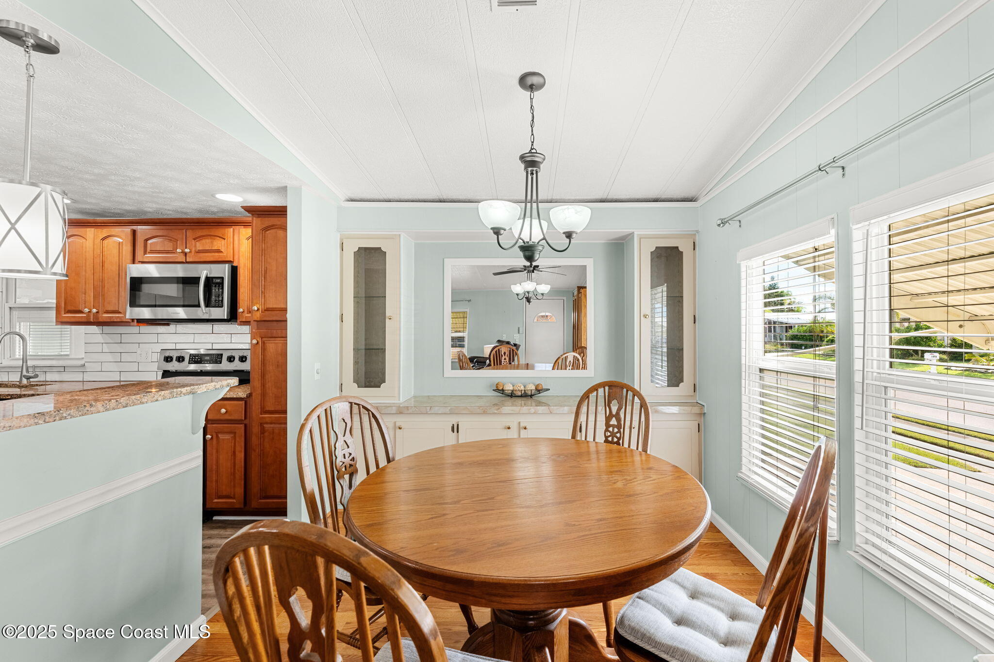1885 Mango Street Northeast Palm Bay, FL 32905 - Photo 6 of 36 a view of a dining room with furniture and window