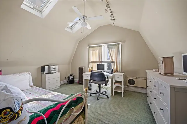 a room that has a bed and a chair in it