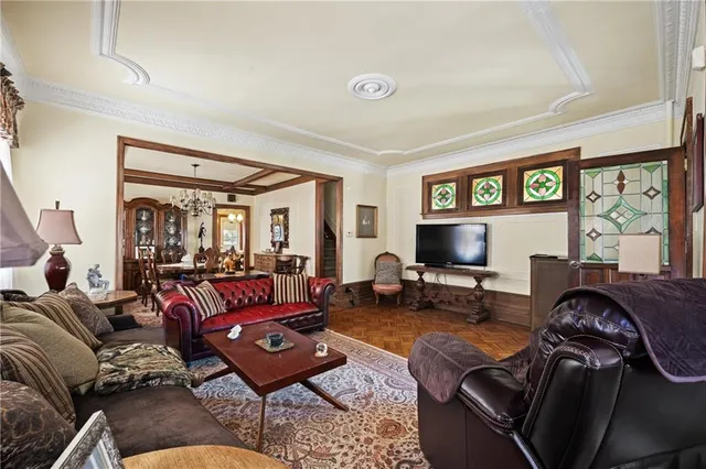 a living room with furniture and a flat screen tv