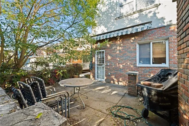 a view of a chairs and table in the patio