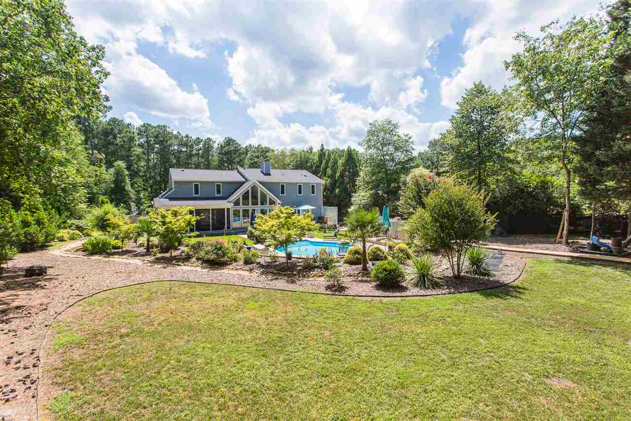 4409 Wood Valley Drive Raleigh, NC 27613 - Photo 30 of 30 The backyard has been lovingly landscaped w/plants that thrive in NC's climate and offer a burst of color. There are palm trees too! New Septic System. Installed 12 x 30 ft outdoor shed. There is also a picturesque dry creek bed of rock and stone. Private Paradise amid Lush Landscaping