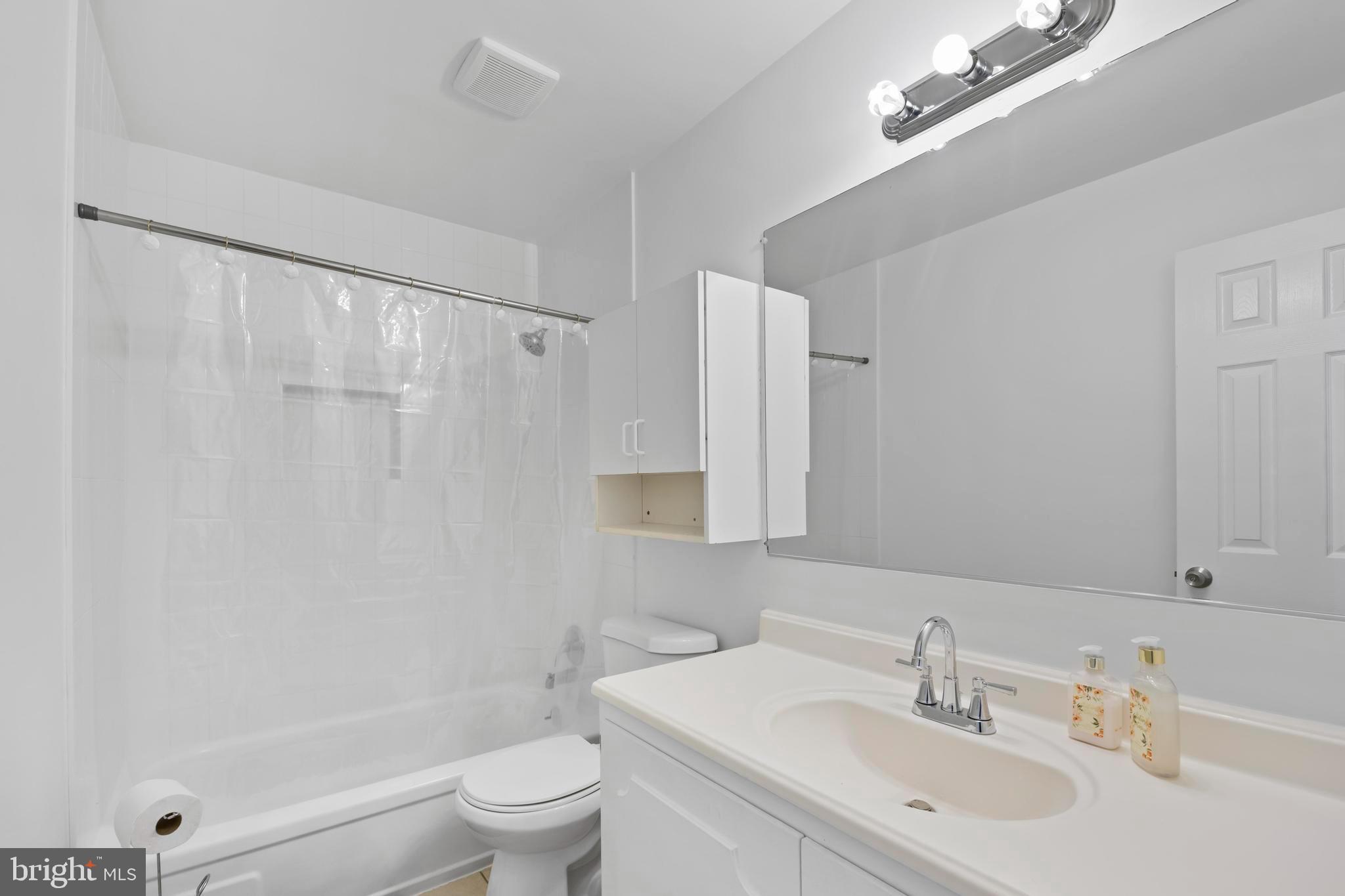 2703 Shawn Court Fort Washington, MD 20744 - Photo 19 of 47 a bathroom with a sink toilet and shower