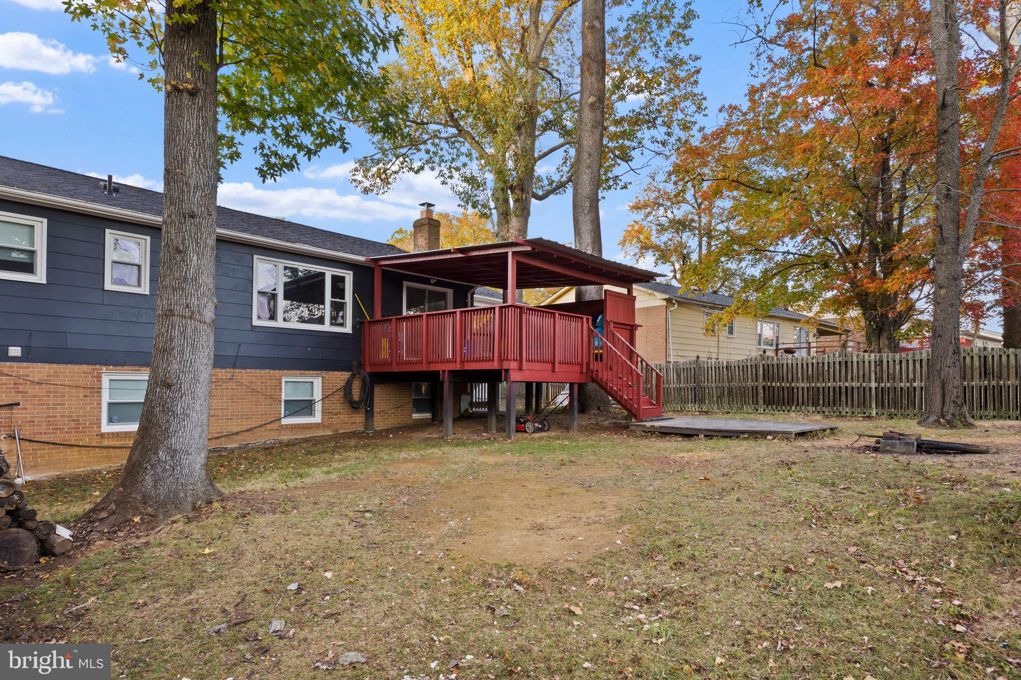 2703 Shawn Court Fort Washington, MD 20744 - Photo 41 of 47 a backyard of a house with barbeque oven table and chairs