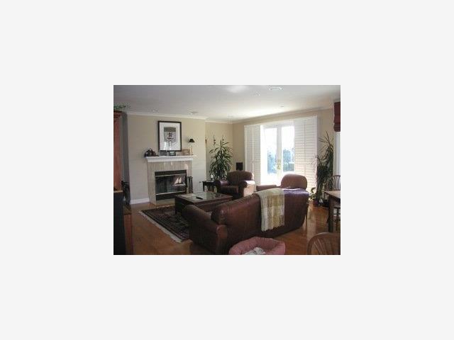 159 Cypress Point Road Half Moon Bay, CA 94019 - Photo 5 of 5 a living room with furniture and a fireplace