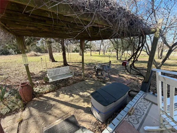 a view of a backyard with sitting area