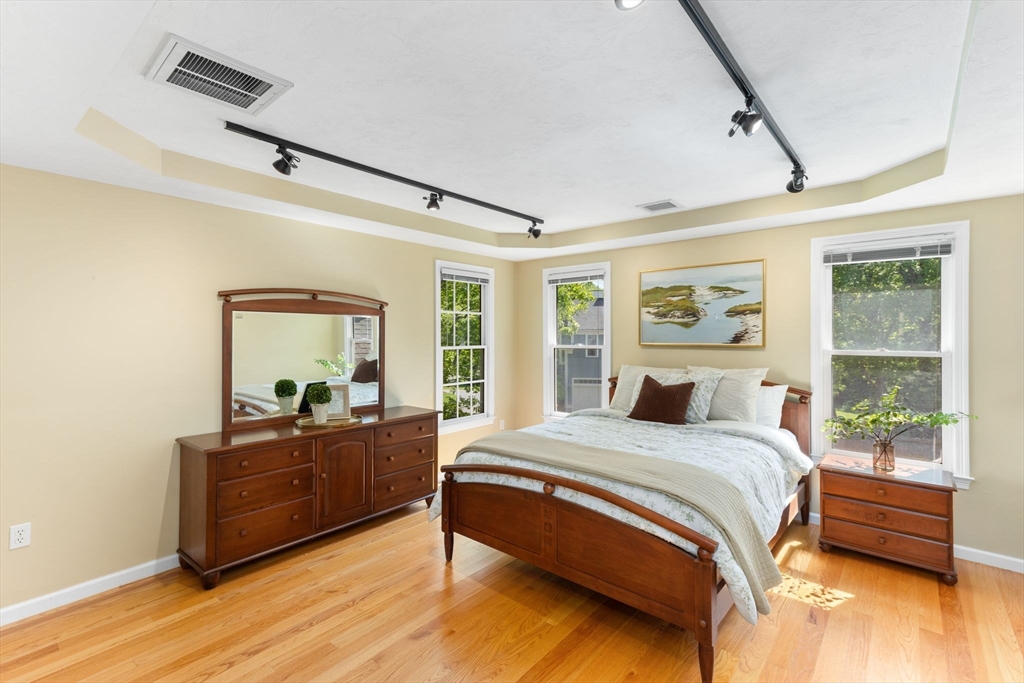 5 Linden Glen Road Canton, MA 02021 - Photo 18 of 42 a bedroom with a bed and wooden floor