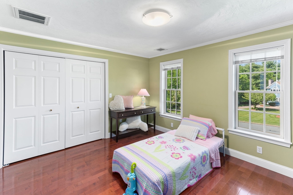 5 Linden Glen Road Canton, MA 02021 - Photo 20 of 42 a bedroom with a bed and wooden floor