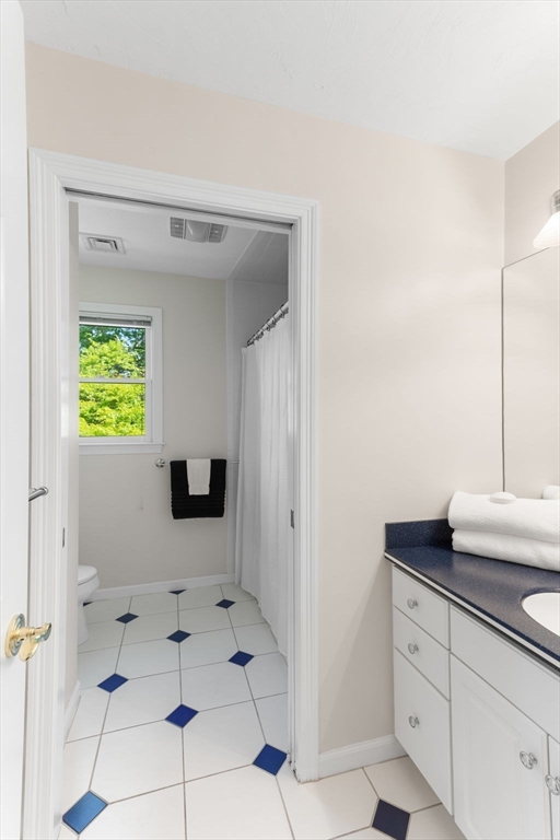 5 Linden Glen Road Canton, MA 02021 - Photo 21 of 42 a bathroom with a sink and a mirror