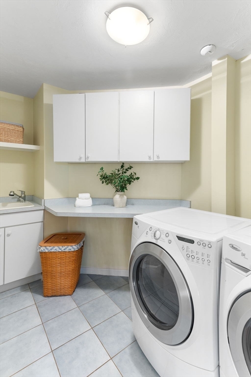 5 Linden Glen Road Canton, MA 02021 - Photo 25 of 42 a kitchen with a sink a stove and cabinets