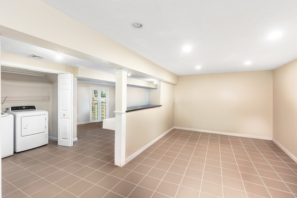 5 Linden Glen Road Canton, MA 02021 - Photo 26 of 42 a view of an empty room with a stove