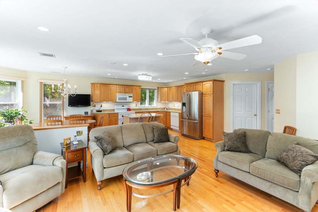 5 Linden Glen Road Canton, MA 02021 - Photo 27 of 42 a living room with furniture and a flat screen tv