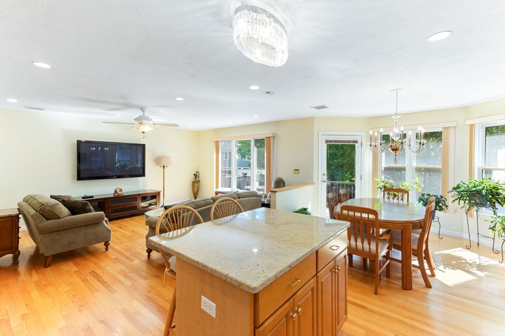 5 Linden Glen Road Canton, MA 02021 - Photo 28 of 42 a living room with furniture a dining table and a potted plant