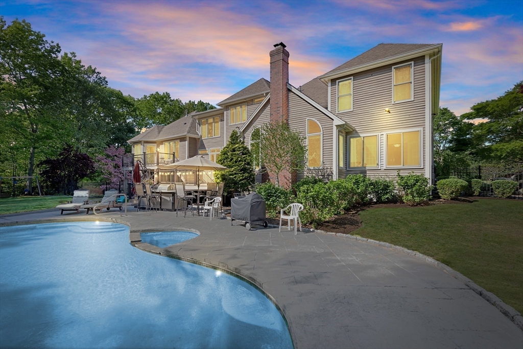 5 Linden Glen Road Canton, MA 02021 - Photo 37 of 42 a front view of a house with a garden and trees