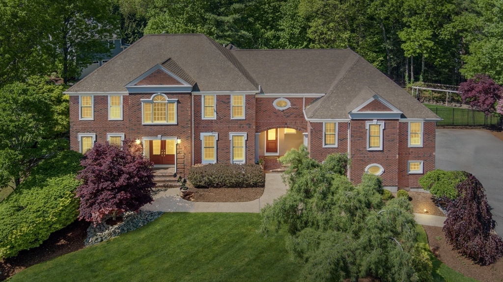 5 Linden Glen Road Canton, MA 02021 - Photo 38 of 42 a front view of a house with a yard and potted plants