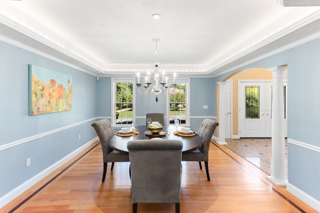 5 Linden Glen Road Canton, MA 02021 - Photo 5 of 42 a dining room with furniture a chandelier and wooden floor