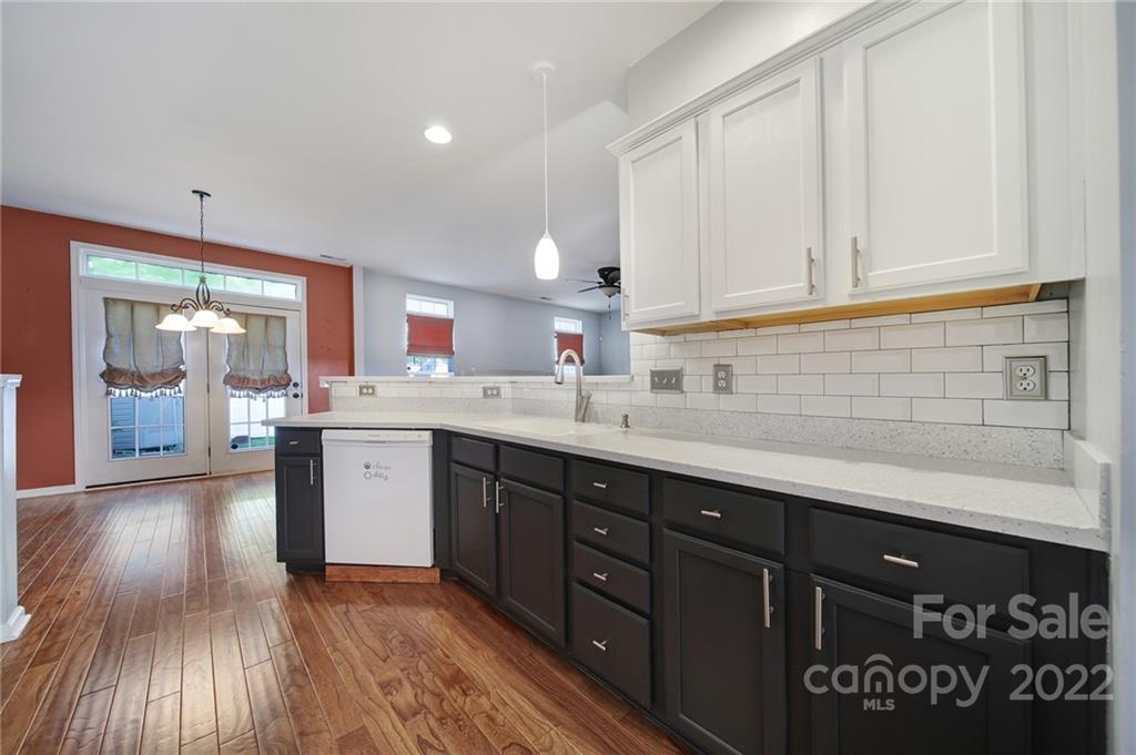 618 Bayou Circle Clover, SC 29710 - Photo 13 of 37 a kitchen with stainless steel appliances granite countertop a sink cabinets and wooden floor