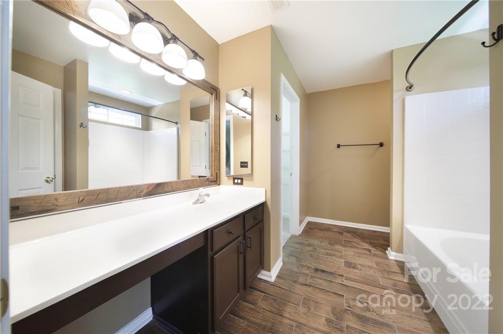 618 Bayou Circle Clover, SC 29710 - Photo 26 of 37 a bathroom with a sink a mirror and a shower
