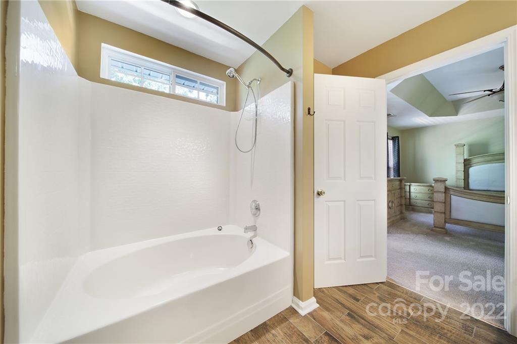 618 Bayou Circle Clover, SC 29710 - Photo 27 of 37 a bathroom with a bathtub and a shower