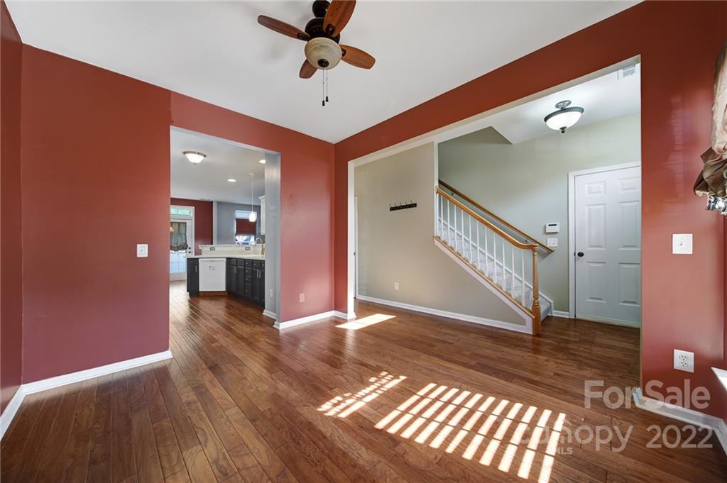 618 Bayou Circle Clover, SC 29710 - Photo 5 of 37 a view of a hallway with wooden floor and a chandelier
