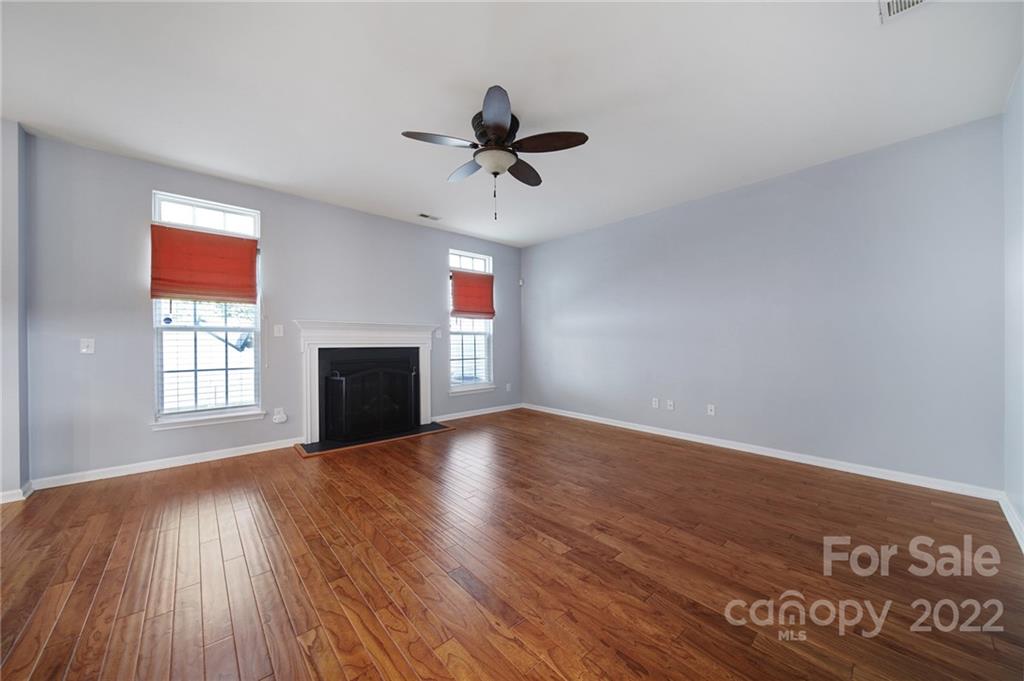 618 Bayou Circle Clover, SC 29710 - Photo 7 of 37 wooden floor in an empty room with a window