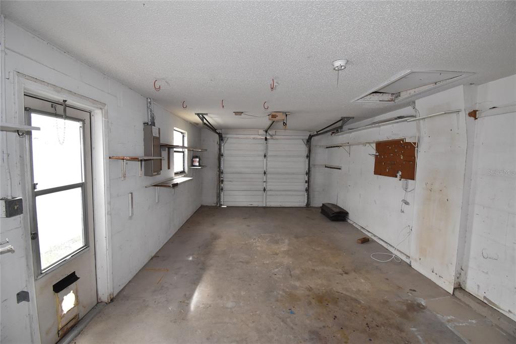 7615 Karen Drive Port Richey, FL 34668 - Photo 21 of 24 a view of a garage