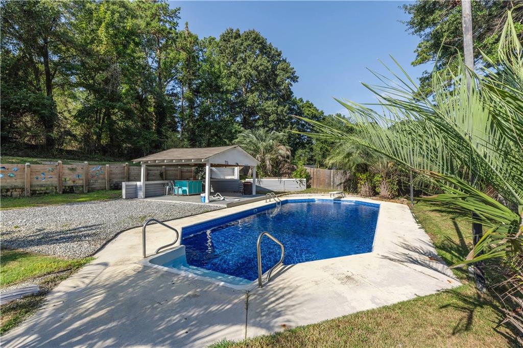 4 Ford Road Phenix City, AL 36869 - Photo 32 of 52 In-ground swimming pool with concrete surround