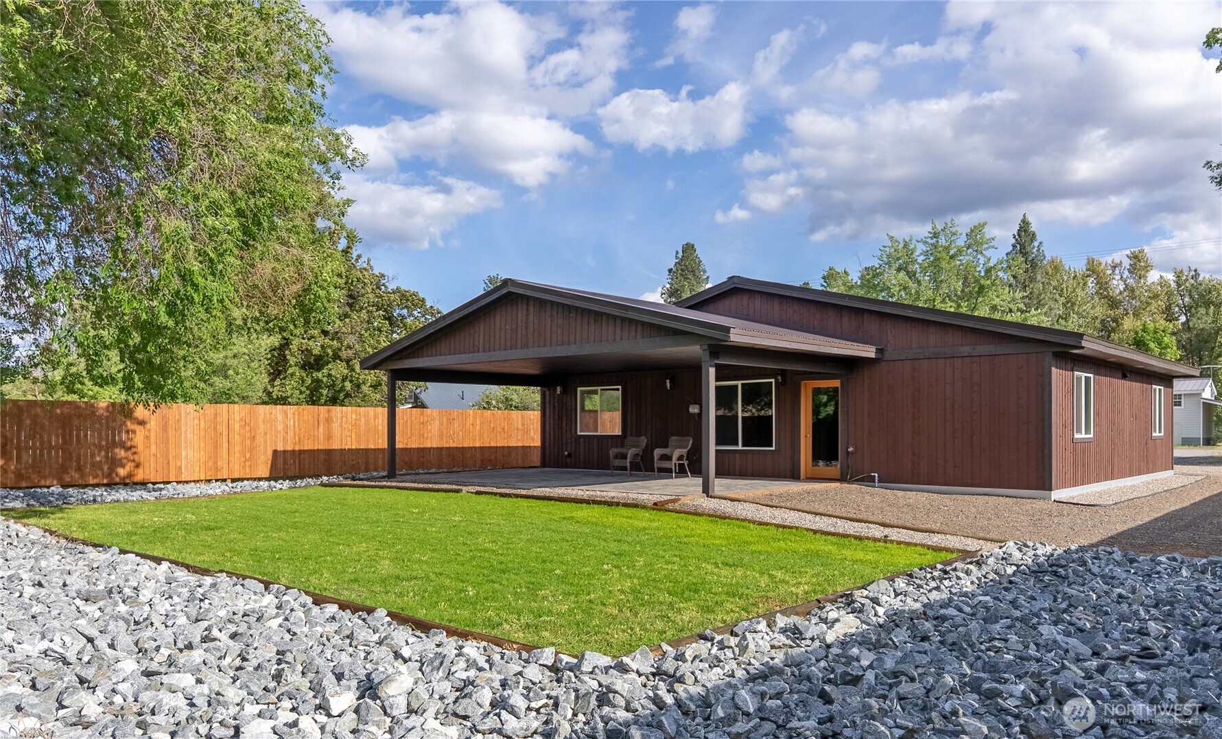 1110 Riverside Avenue Twisp, WA 98856 - Photo 5 of 28 a front view of house with yard and green space