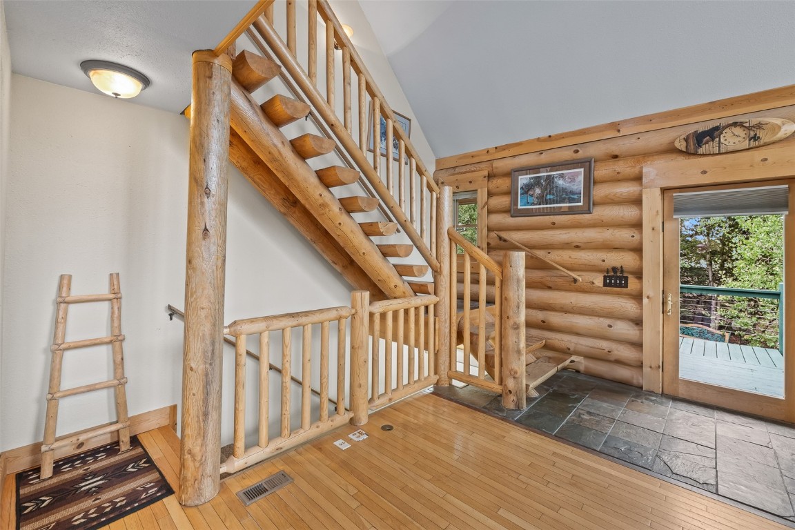 486-432 Turk Pony Way Como, CO 80456 - Photo 13 of 49 a view of staircase with wooden floor and windows